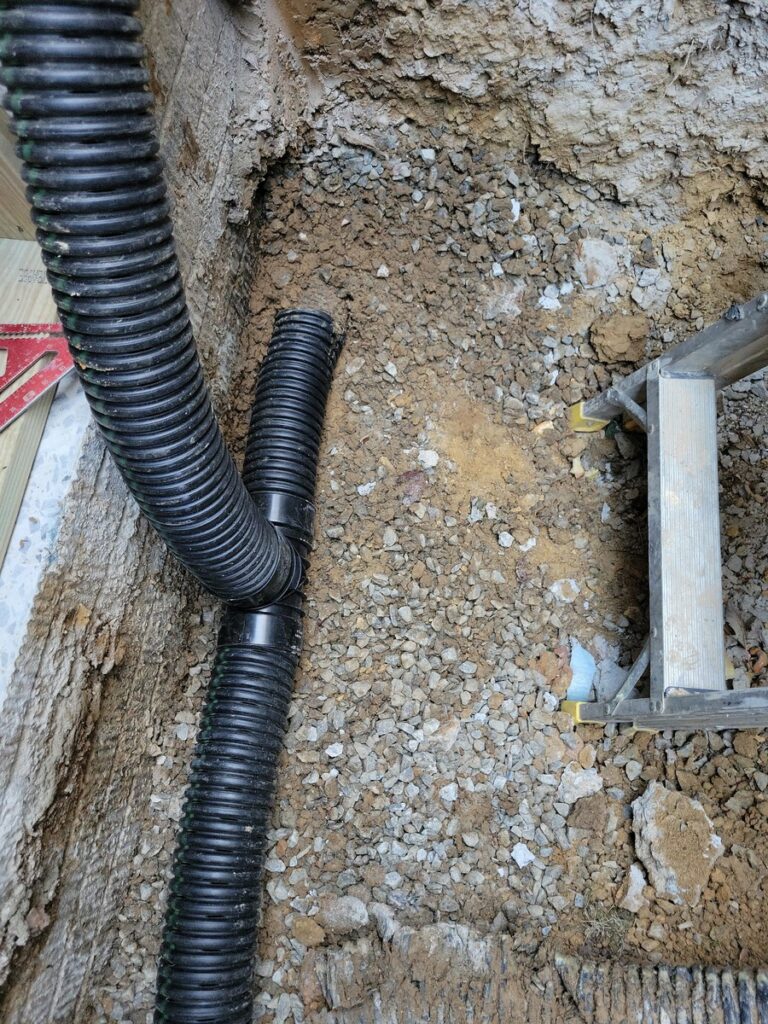 Excavation and drainage work for egress window installation in Arlington VA