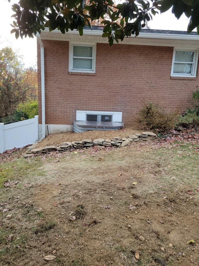 Stacked stone Boman Kemp window well in Arlington VA