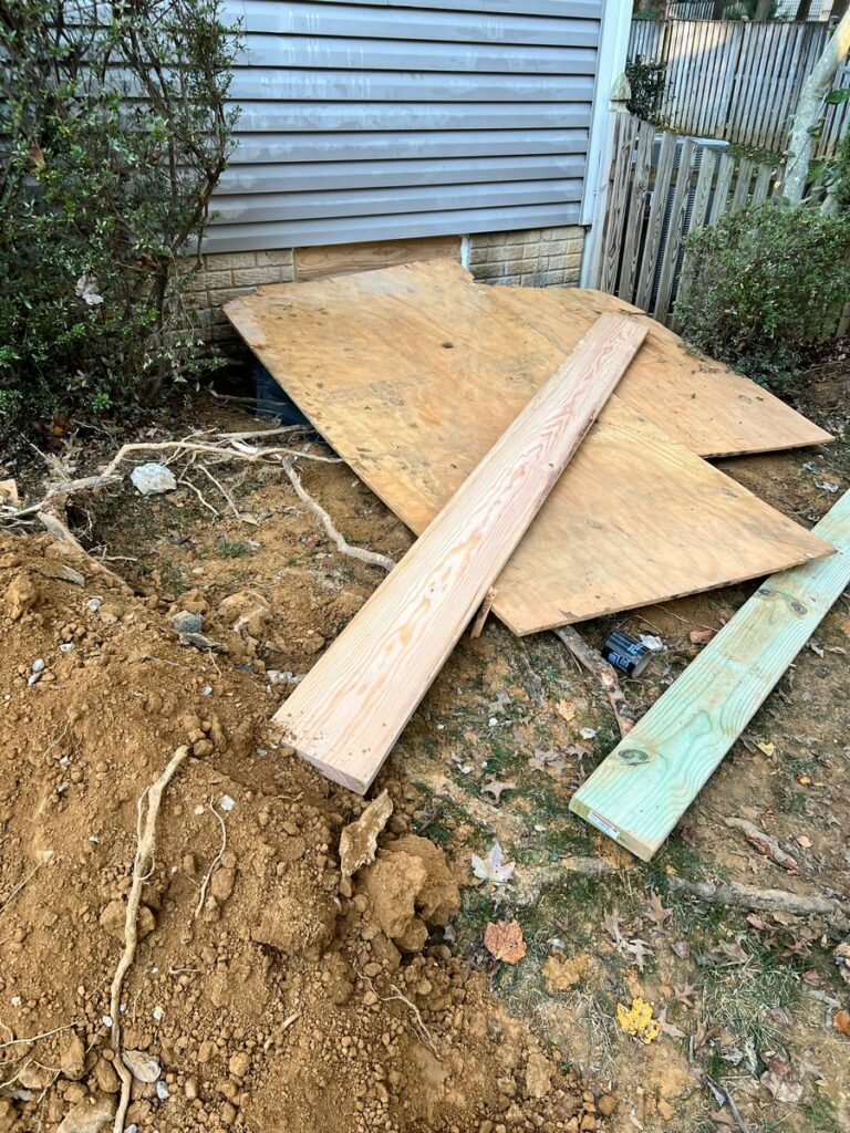 Excavation and drainage work for egress window installation in Burke VA