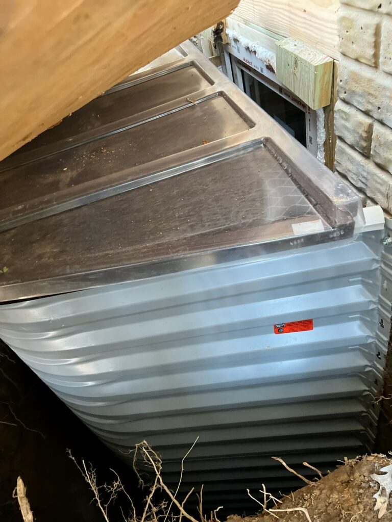 White Boman Kemp window well 